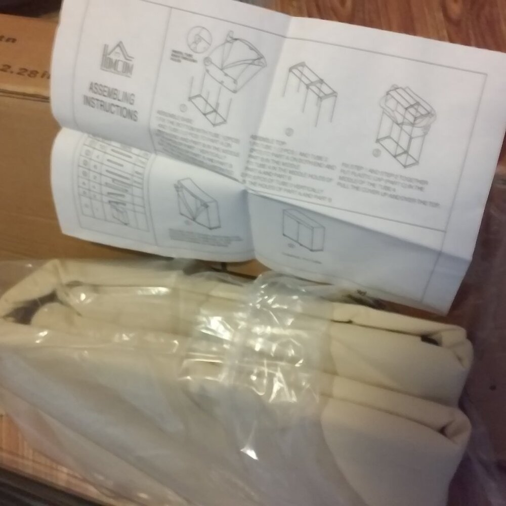 New Unused Portable Clothes Closet New Beige Cover Black Rods Box11 x 3.15 x 32.